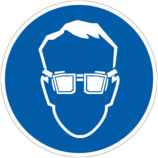 Знак «Работать в защитных очках»